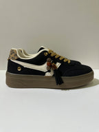 Sneakers EMI, colore nero, vista laterale: finitura con pannelli texturizzati, suola platform.